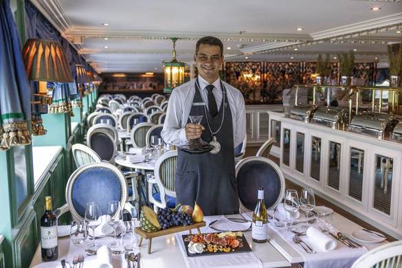 UNIWORLD Boutique River Cruises S.S. Catherine Cézanne Restaurant Sommelier.jpeg